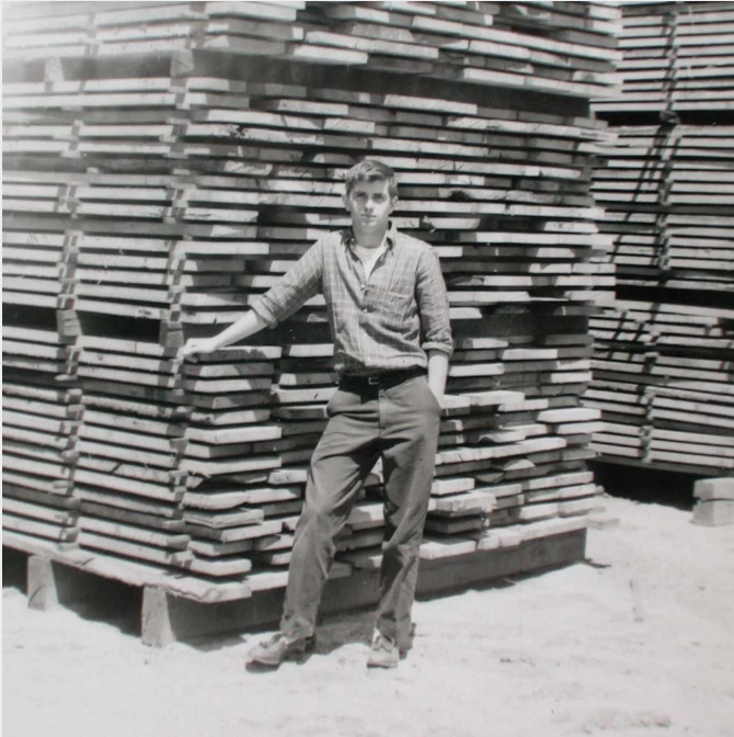 archie macdonald, founder, standing in front of green on sticks lumber